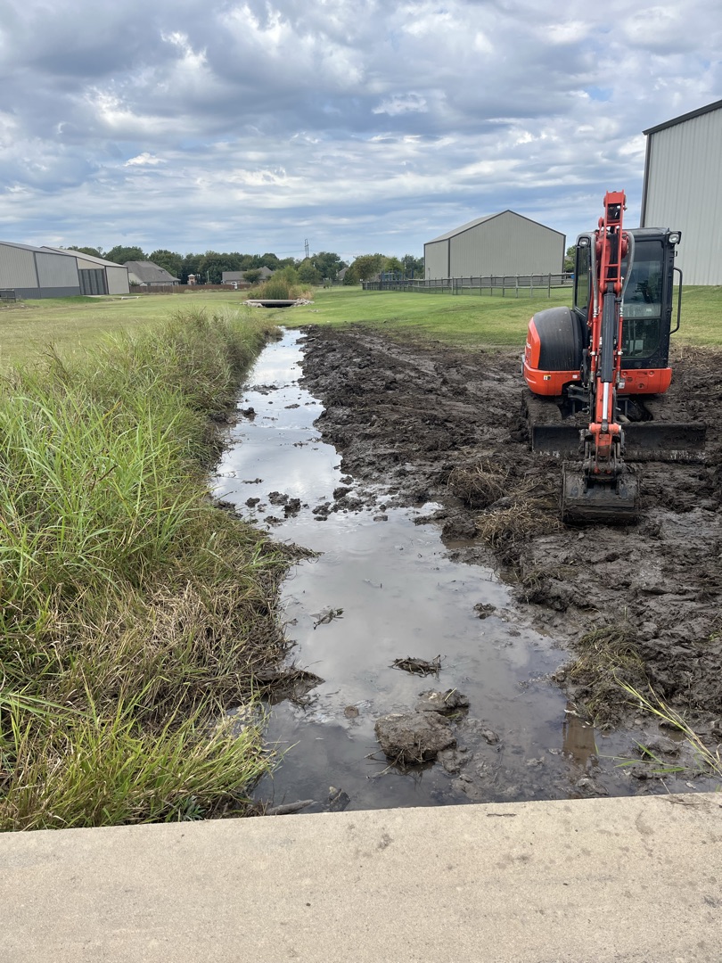Lifted Construction LLC excavator digging on a residential project in Rogers County, Oklahoma